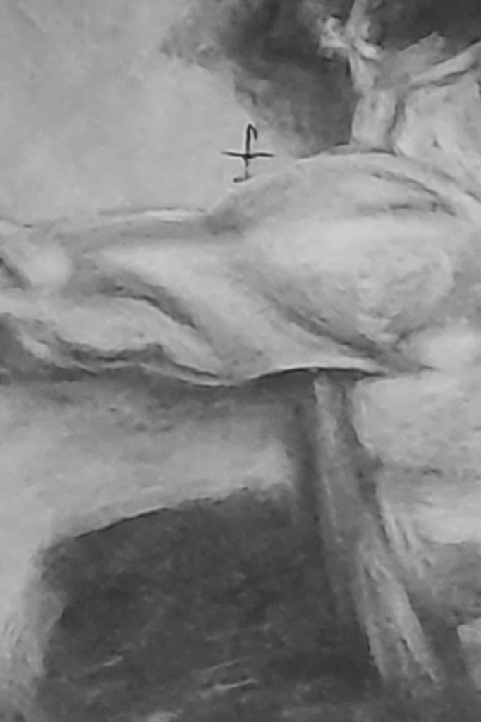 picture of arm and cross